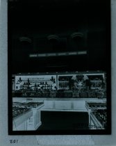 Black and white negative of interior sales area, taken in October 1937 by A