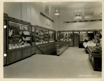 Black and white photograph of interior sales area stairs, taken in October