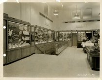 Black and white photograph of interior sales area stairs, taken in October