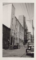 Black and white photograph of Kress back alley