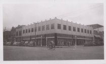 Black and white photograph of a corner buidling