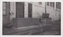 Black and white photograph of Kress back alley