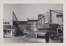 Black and white photograph of Kress construction site with frame being inst