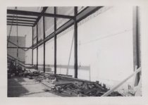 Black and white photograph of Kress construction site with frame being inst