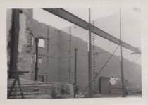 Black and white photograph of Kress construction site with frame being inst