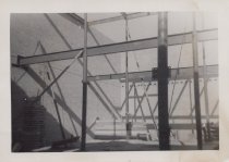 Black and white photograph of Kress construction site with frame being inst