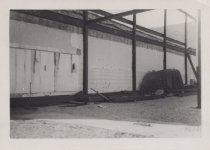 Black and white photograph of Kress construction site with frame being inst
