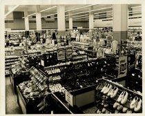 Black and white photo of interior domestic, shoes and clothing merchandise
