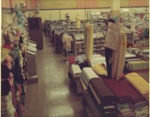 Color photograph of interior clothing and toys sales area, taken in March 1