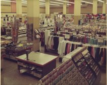 Color photograph of interior sewing and clothing sales area, taken in March