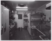 Black and white photograph of back kitchen