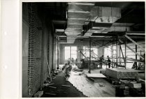Black and white photograph of interior construction work, taken in June 195