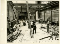Black and white photograph of interior construction work, taken in April 19