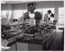 Black and white photograph of clothing display