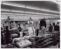 Black and white photograph of clothing display