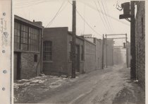 Black and white photograph of back alley