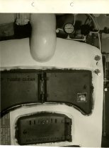 Black and white photograph of interior water heater, taken in November 1951