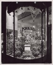 Black and white photograph of Christmas ornament window display