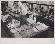 Black and white photograph of button down shirt display