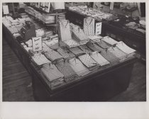 Black and white photograph of button down shirt display