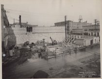 Black and white photograph of construction from above