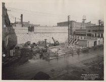 Black and white photograph of construction from above