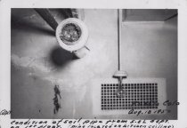 Black and white photograph of ceiling pipe