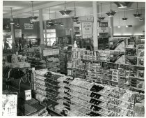 Black and white photograph of interior sales area likely during store grand