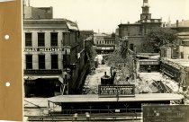 Black and white photograph of front view of wall supports construction, tak