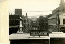 Black and white photograph of rear view of construction, taken in August 19