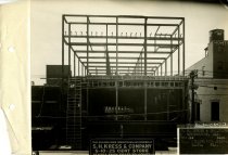 Black and white photograph of skeleton rear view during construction, taken