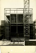 Black and white photograph of skeleton rear view during construction, taken
