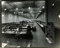 Black and white photograph of interior sales area, received on April 10, 19
