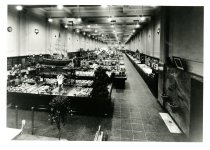 Black and white photographic copy of interior sales area (photographer and