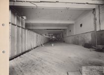 Black and white photograph of interior construction