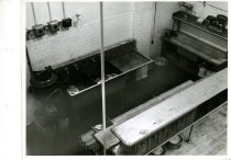 Black and white photograph of interior restaurant kitchen, received on Janu