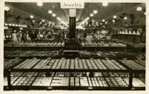 Black and white photograph print depicting the interior jewelry sales area,
