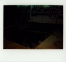 Color polaroid depicting  interior floor damage, taken in August 1979 (phot