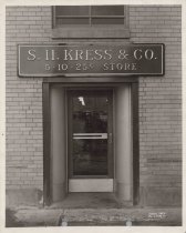Black and white photo of the main entrance to the Kress store with the Kres