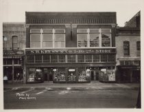 Black and white photograph of the main entrance to the Kress store. Photo s