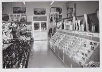 Black and white photograph of Kress checkout section and handbag section.