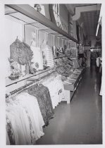 Black and white photograph of Kress sales floor showing advertising for the