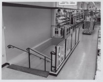 Black and white photograph of Kress sales floor highlighting stairs to the