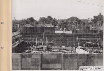 Black and white photograph of Kress construction site while the frame was b