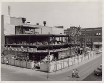 Black and white photograph of Kress construction site while the walls were