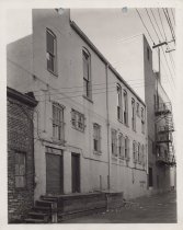 Black and white photograph of Kress back alley