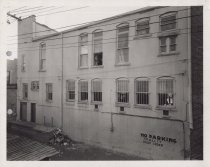Black and white photograph of Kress back alley