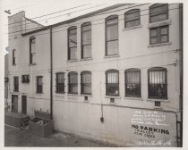 Black and white photograph of Kress back alley