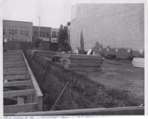 Black and white photograph of Kress construction site with the lot being cl