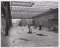 Black and white photograph of Kress construction site with the frame being